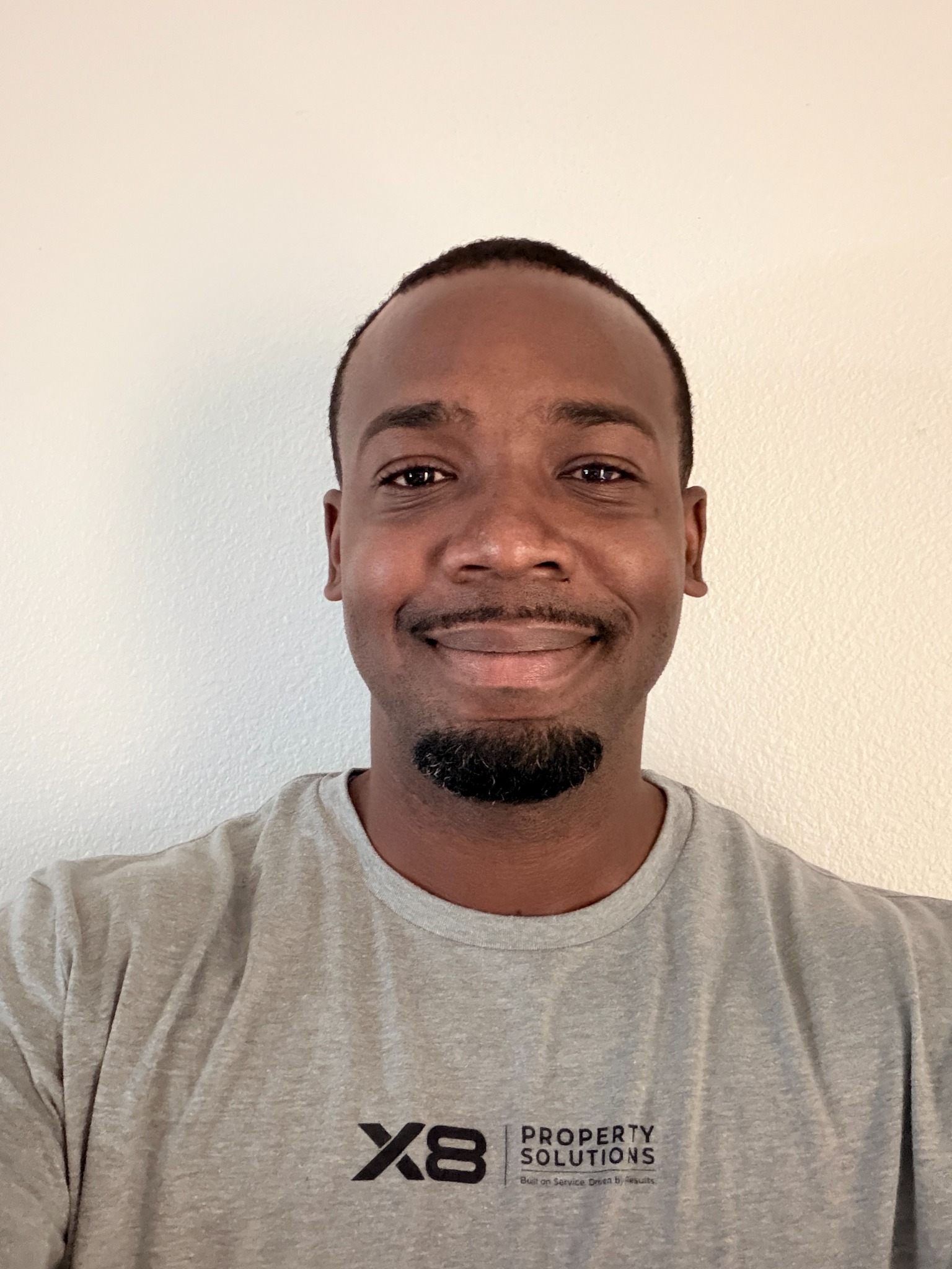 Ja’vion Brown, owner of X8 Property Solutions, wearing his X8 shirt